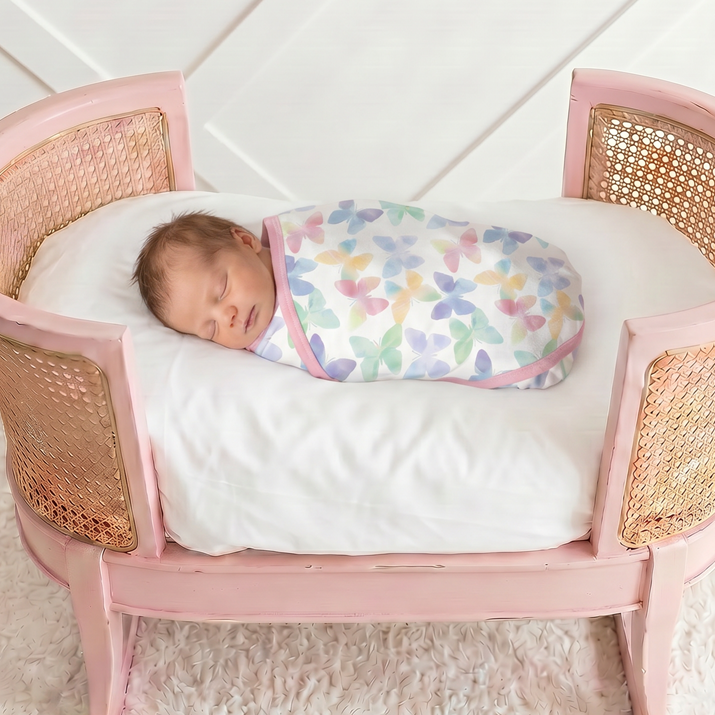 Grace Wings swaddle blanket in bamboo blend fabric with angel wings print, shown spread out
