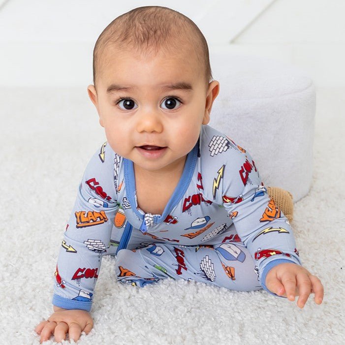 Baby footie pajamas with an all-over colorful graffiti print and a full-length front zipper.