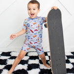 Short-sleeve baby pajama set with shorts in a colorful graffiti print