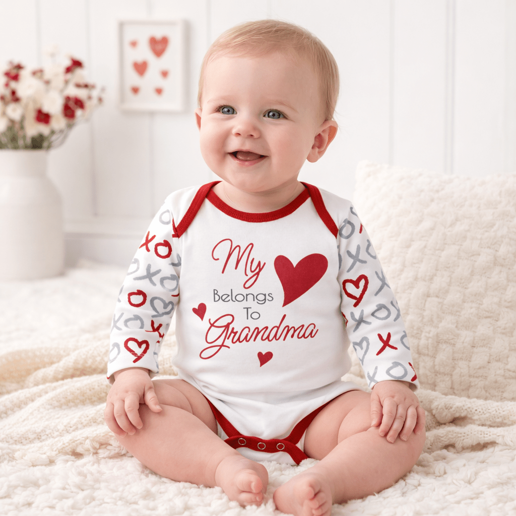 Long-sleeve baby bodysuit with a large heart graphic and XO heart-print sleeves