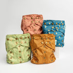 Abstract: Essentials Pocket Cloth Diaper with Athletic Wicking Jersey, Grows with your Baby - Everetts Place Boutique - Pocket Diaper