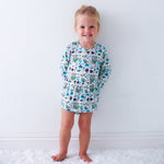 Long-sleeve bodysuit dress with a Hanukkah-themed print and snap closure at the inseam