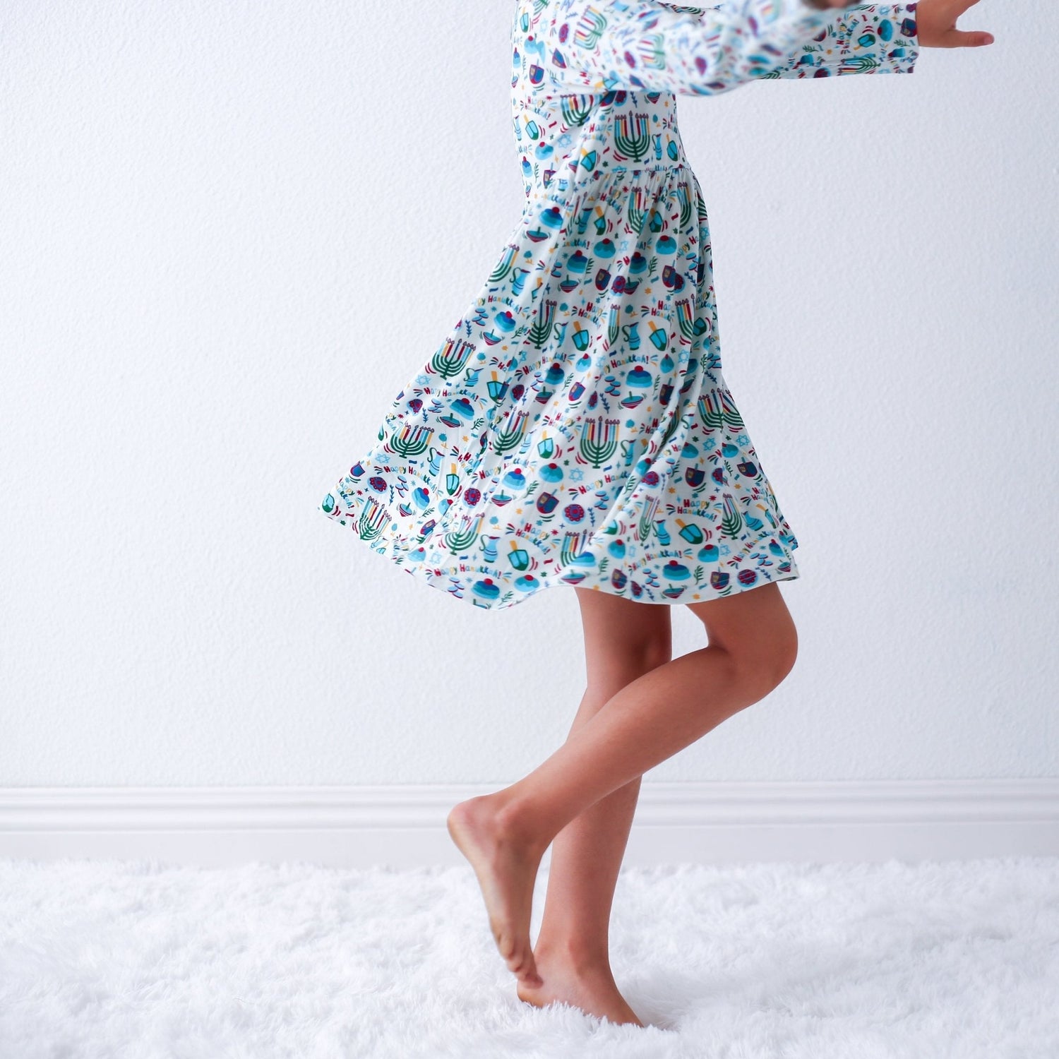 Long-sleeve toddler dress with a full twirl skirt in a Hanukkah-themed print