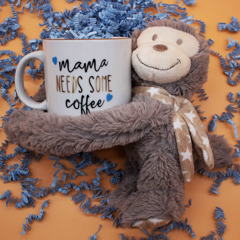 Baby Essential Set with plush toy and mug for mother.