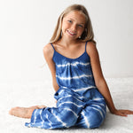 Sleeveless blue and white tie dye jumpsuit with self-tie straps and pockets