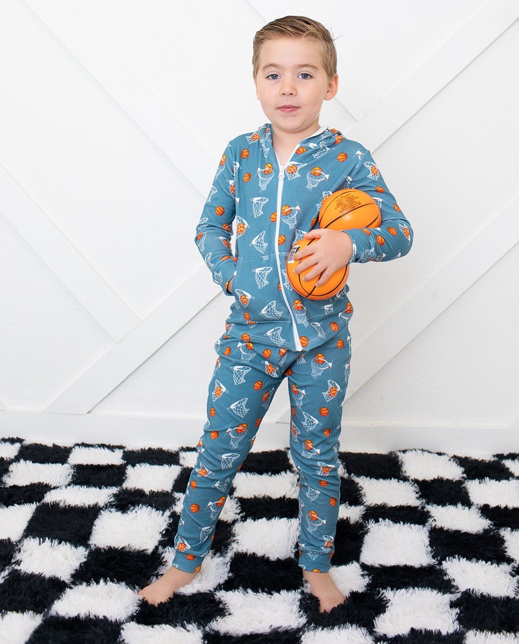 Relaxed fit baby joggers in an all-over basketball hoops print with a drawstring elastic waist