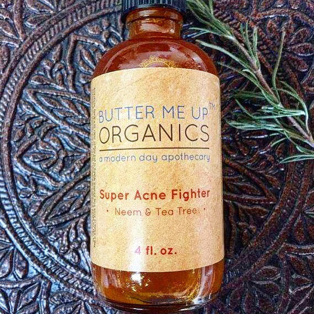 Super Acne Fighter organic treatment bottle with neem and tea tree oils.