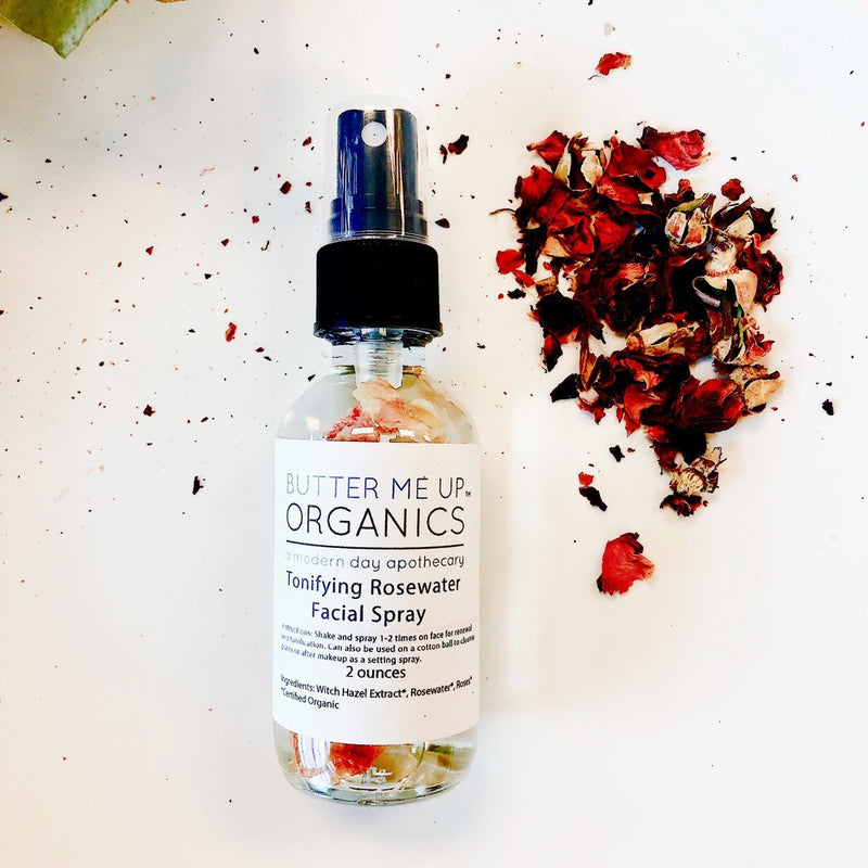 Organic Rosewater Toner in glass bottle with rose petals, ideal for toning, setting makeup, and soothing skin.