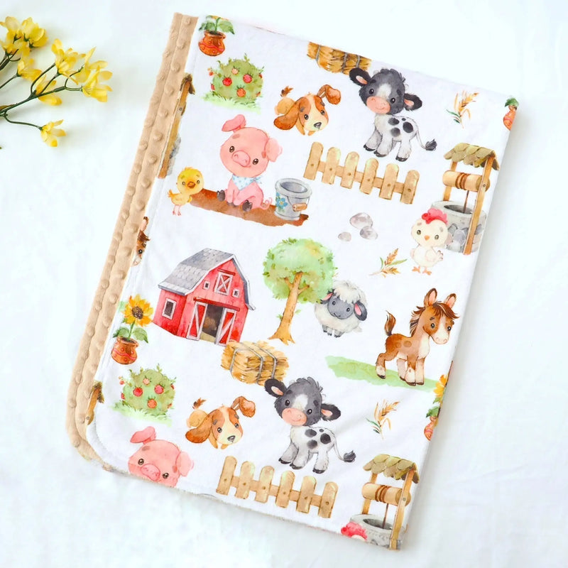 Baby and toddler minky blanket with farm animals pattern, soft and sensory-stimulating.