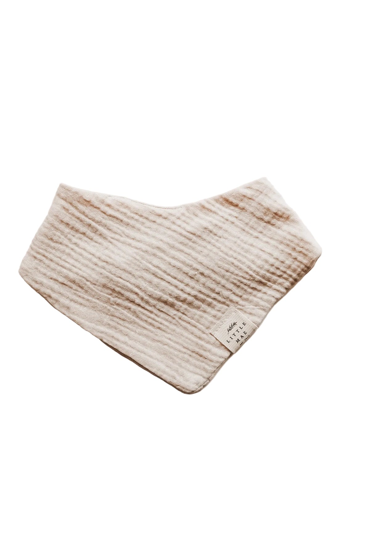 Close-up of an organic oat beige neutral baby bandana bib with a snap closure, folded neatly.