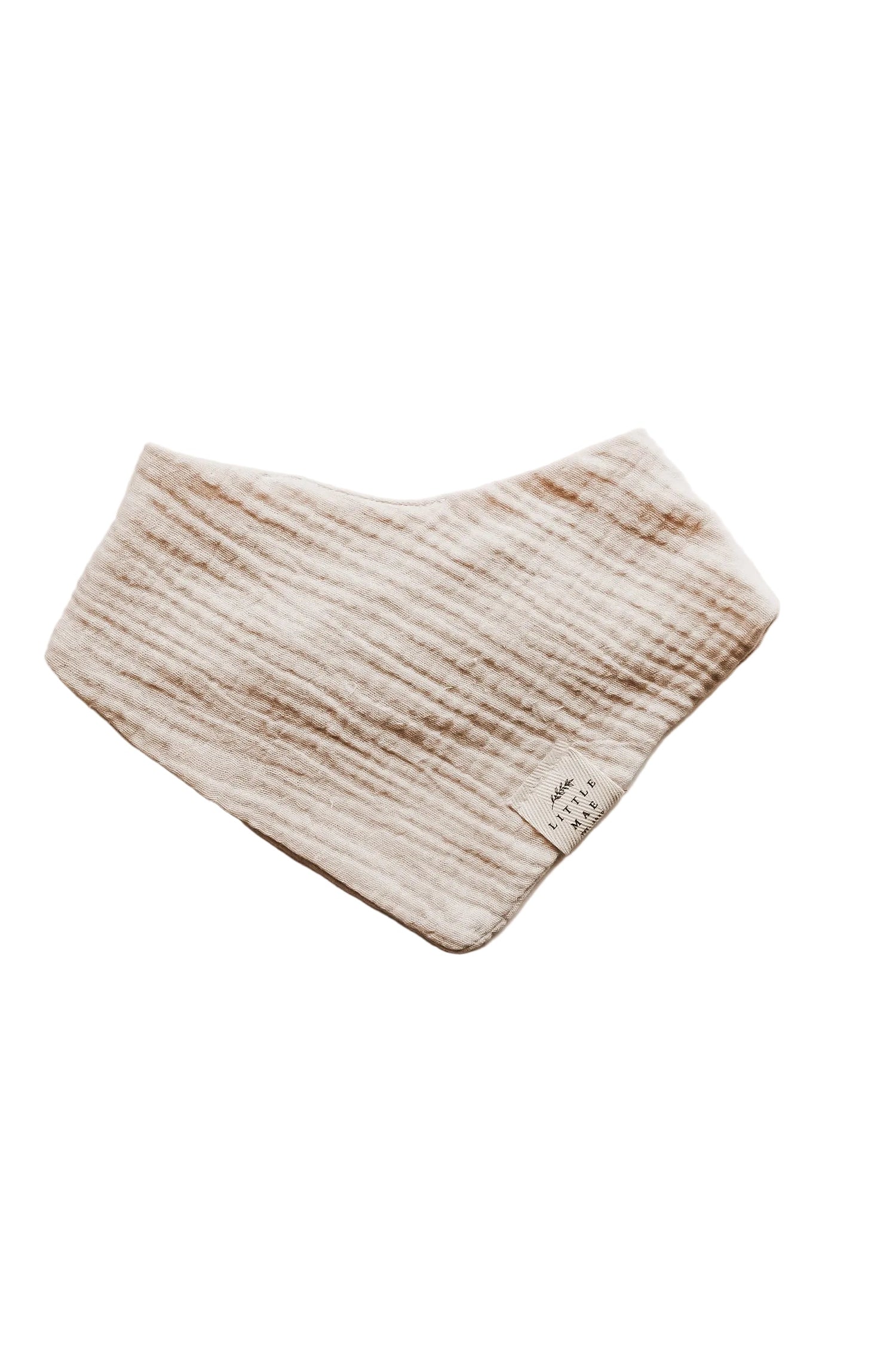 Close-up of an organic oat beige neutral baby bandana bib with a snap closure, folded neatly.