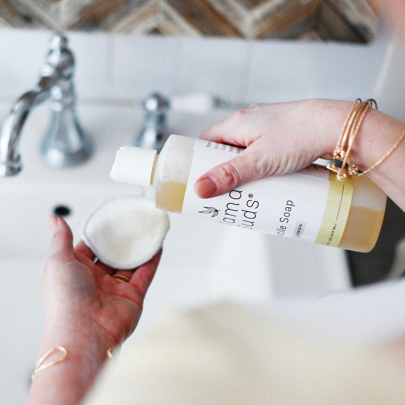 Castile Liquid Soap by MamaSuds in use, shown in a bathroom setting.