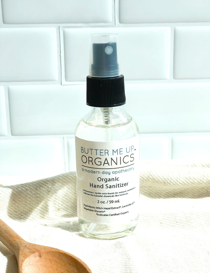 Organic hand sanitizer bottle by Butter Me Up Organics, alcohol-free, triclosan-free, made with organic ingredients, 2 oz with spray top.