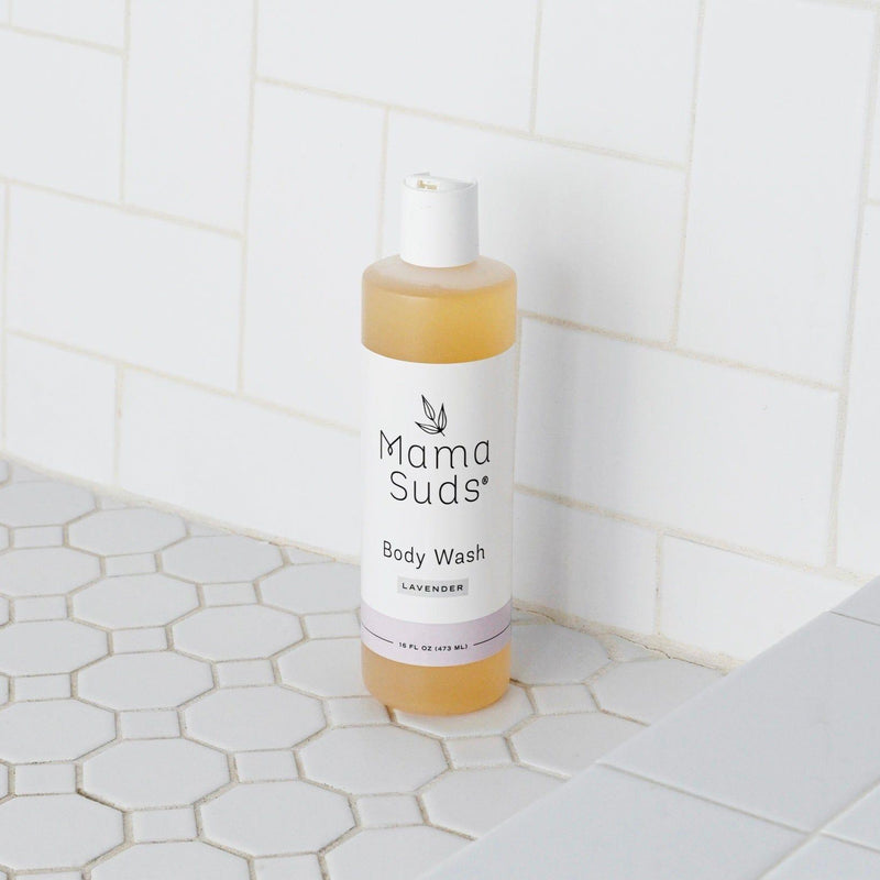 MamaSuds Body Wash Soap in lavender scent on tiled bathroom surface.