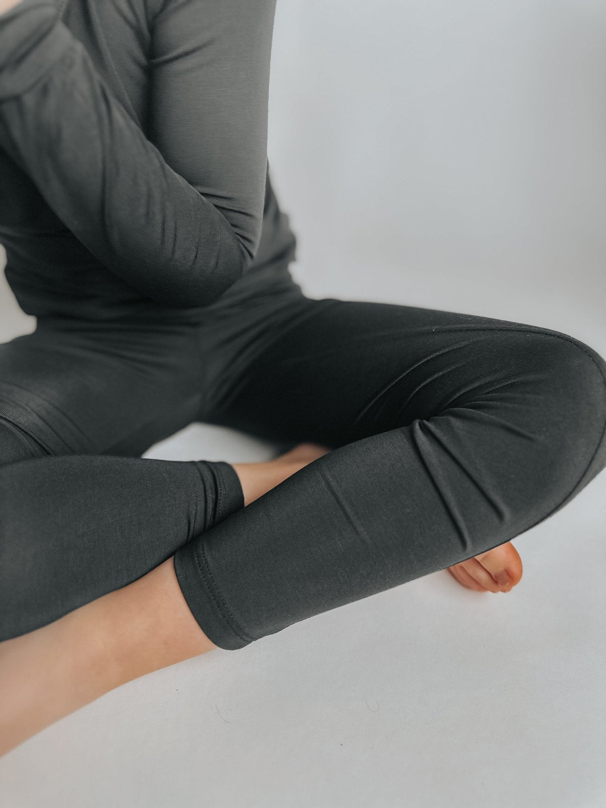 Toddler leggings in solid jet black bamboo fabric with a stretchy fitted cut and full-length legs.