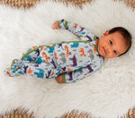 Baby footie pajamas in a safari animal print with a full-length two-way zipper and footed legs.