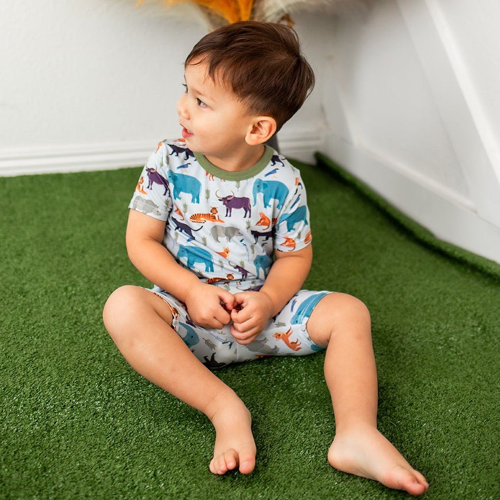 Two-piece pajama set with short sleeves and shorts in a jungle animal print.