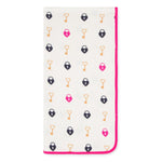 Pink swaddle blanket with a key and heart pattern spread out flat