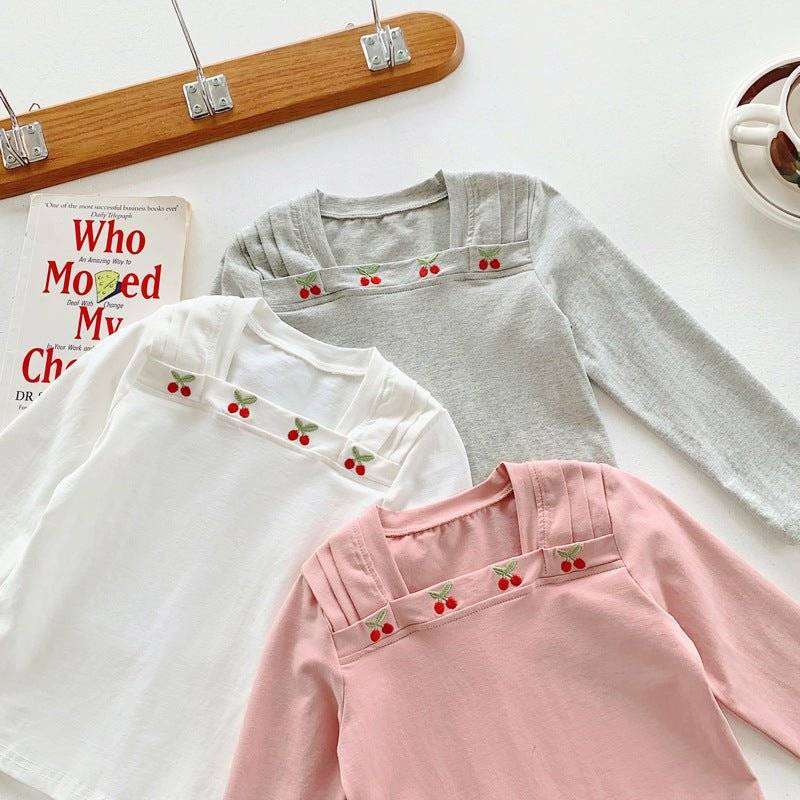 Kids/Girls square neck long sleeves top with cherry pattern in white, pink, and grey.