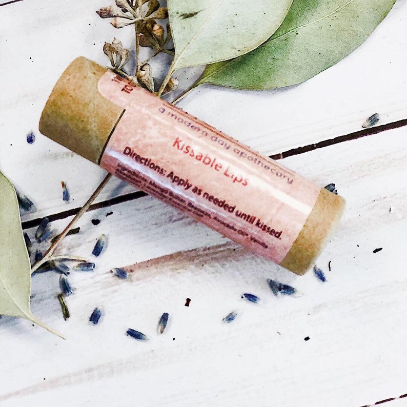 Kissable Lips chapstick in eco-friendly paperboard tube with organic ingredients for moisturizing. Zero waste, plastic-free packaging.