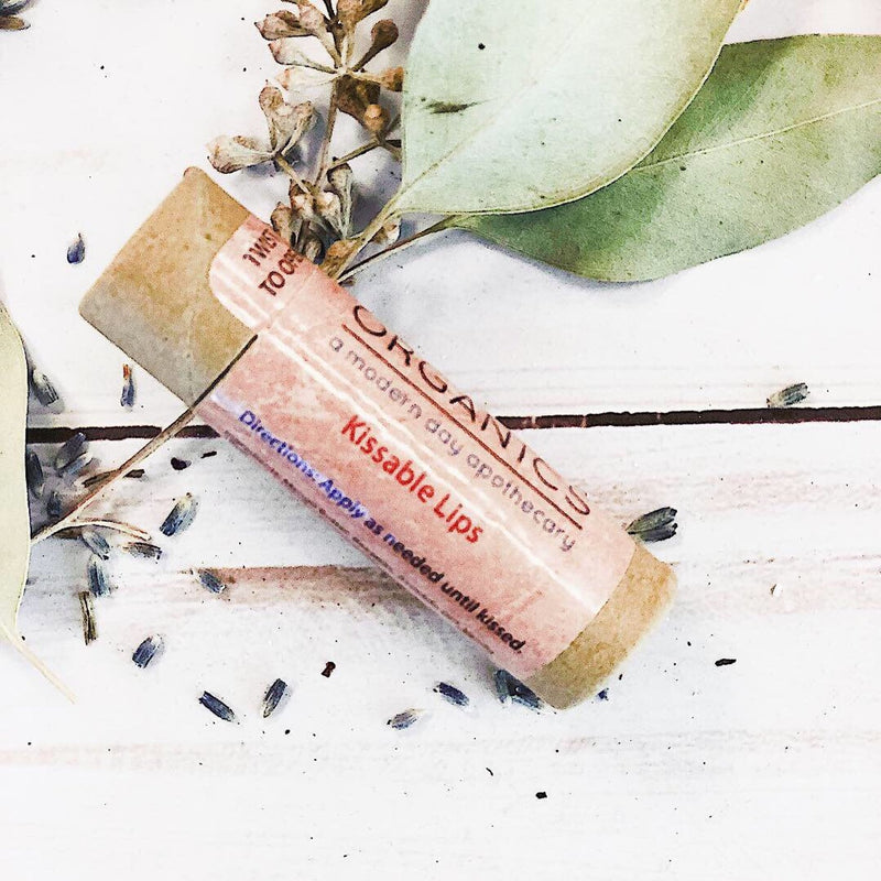 Kissable Lips chapstick lip balm in paperboard tube with natural ingredients.