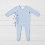 Powder blue knit baby romper with wrap front, side ties, long sleeves and built-in feet