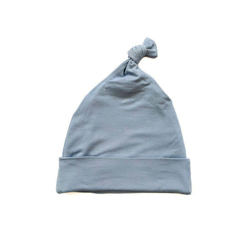 Dusty blue knot hat for newborns made of viscose and spandex.