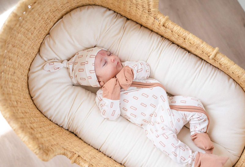 Soft bamboo baby knot hat with neutral rectangle pattern for newborns.