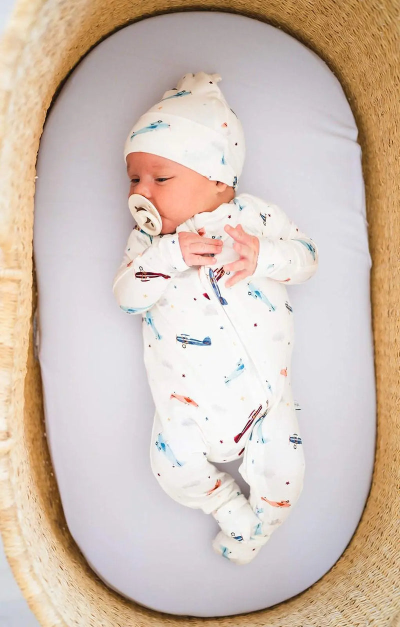 Knot hat with vintage airplane design for newborns, soft and comfortable viscose bamboo blend.