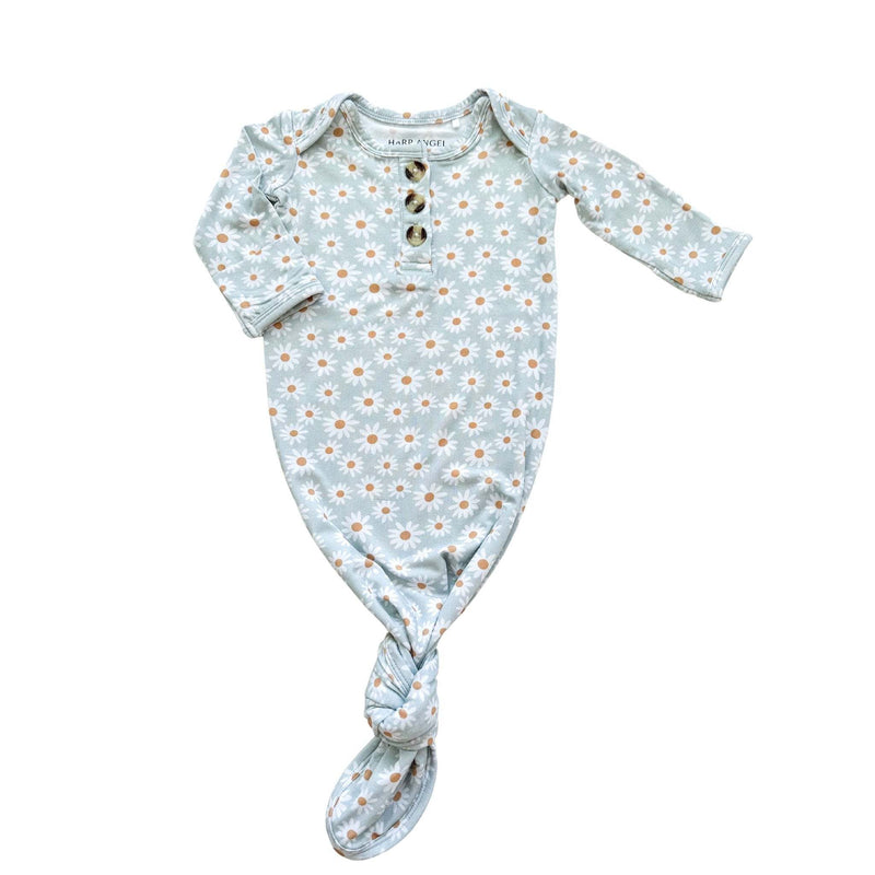 Knotted baby gown with blue daisy pattern and fold-over cuffs for easy diaper changes.
