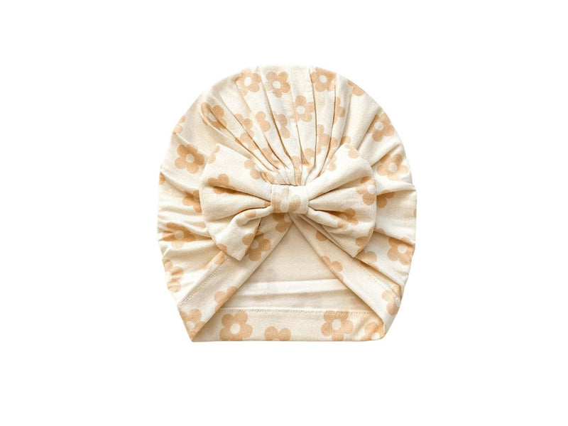 Knotted baby gown in blush daisy pattern, bamboo fabric, ideal newborn outfit.