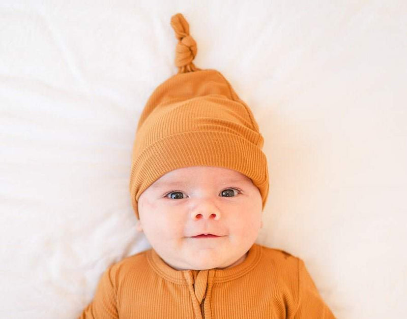 Caramel ribbed knotted baby gown with fold-over cuffs for cozy and breathable sleep.