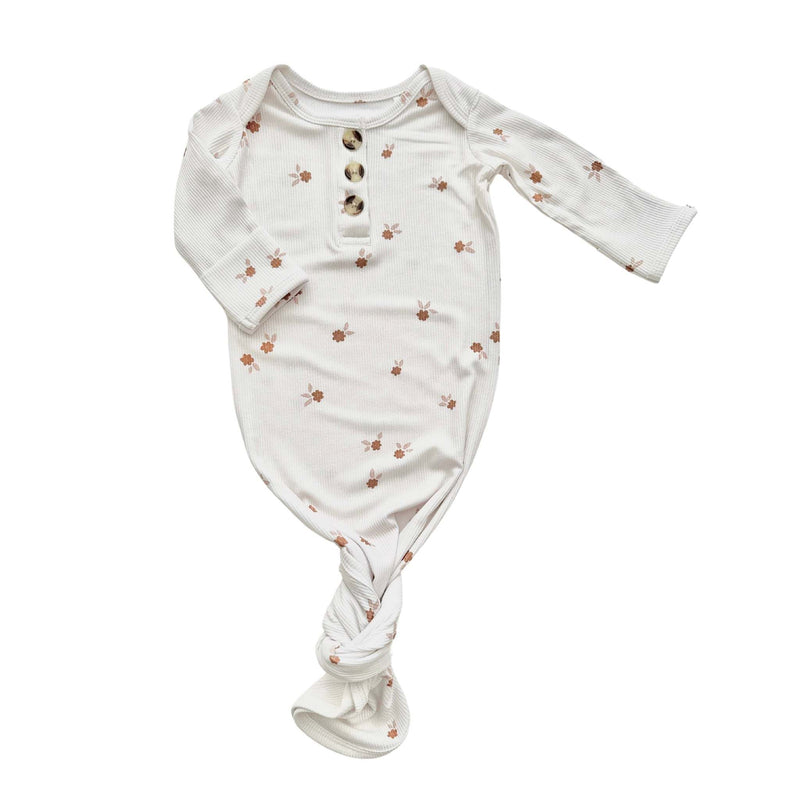 Knotted baby gown in floral print, made from soft bamboo viscose with fold-over cuffs.