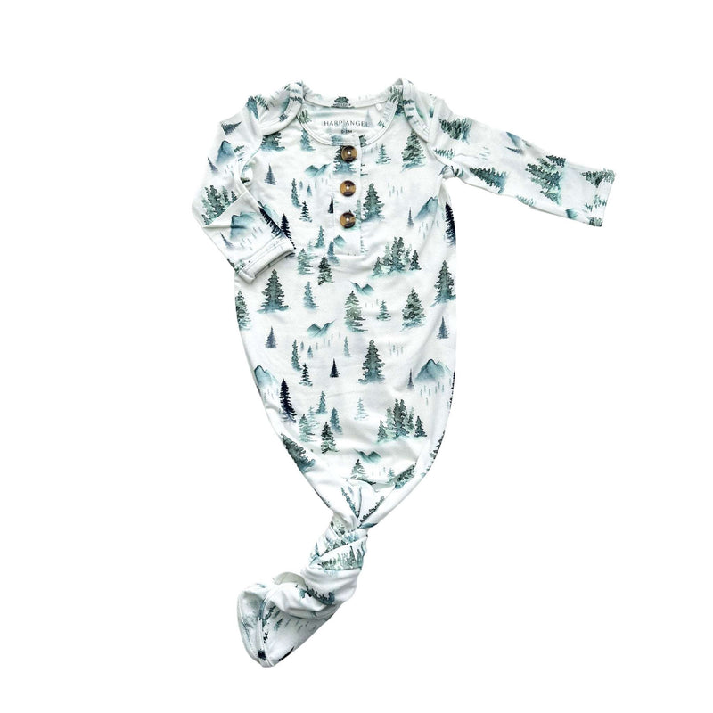 Knotted baby gown with green forest print, featuring fold-over cuffs, for 0-3 months.