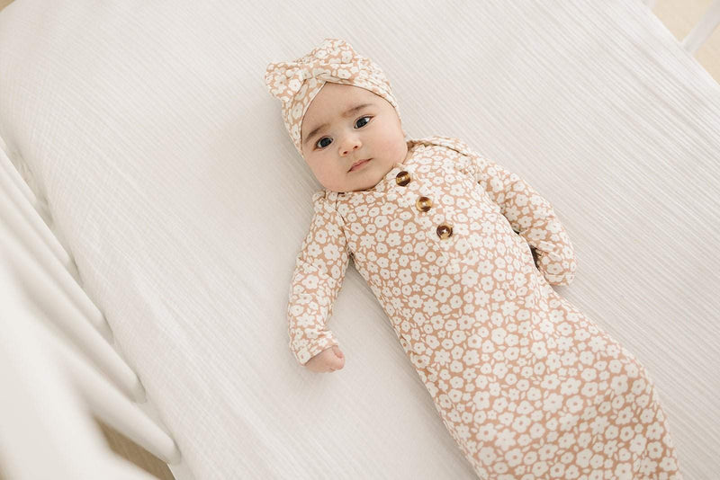 Mocha Ditsy Floral knotted baby gown made of soft bamboo viscose with fold-over cuffs.