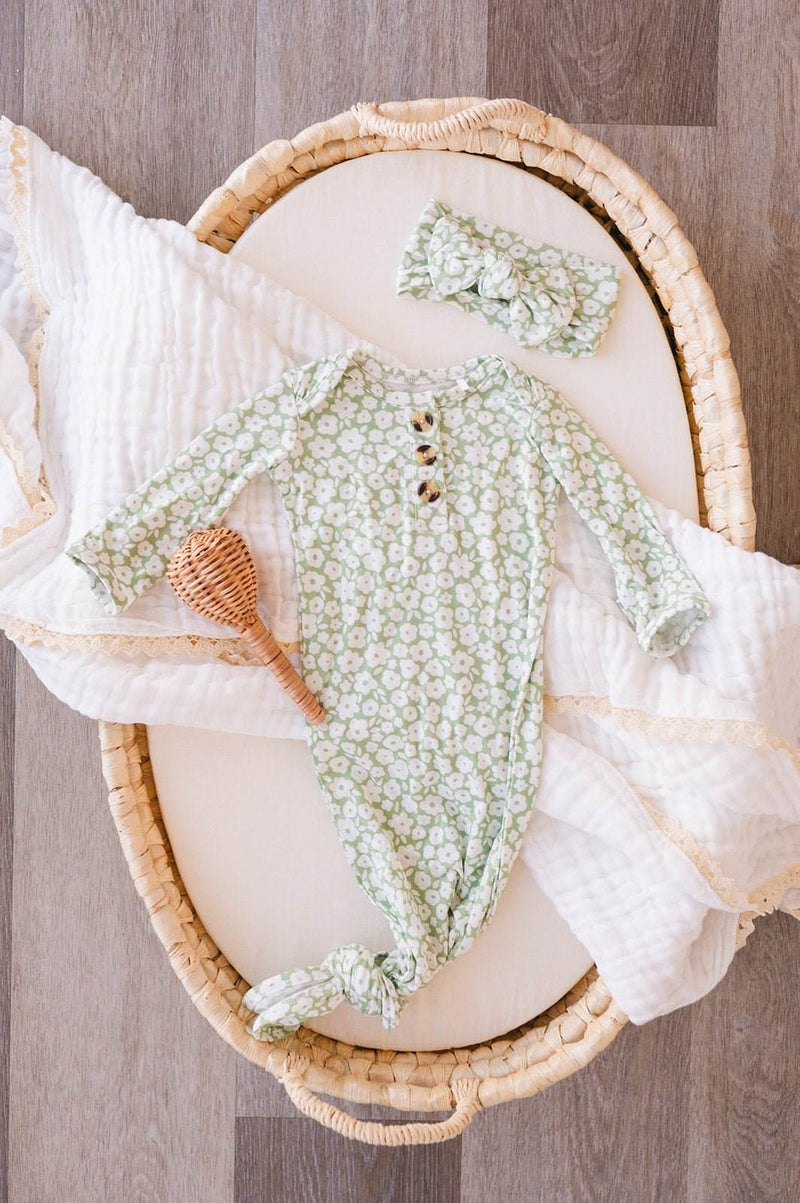 Knotted baby gown in sage ditsy floral print, made from soft bamboo viscose.
