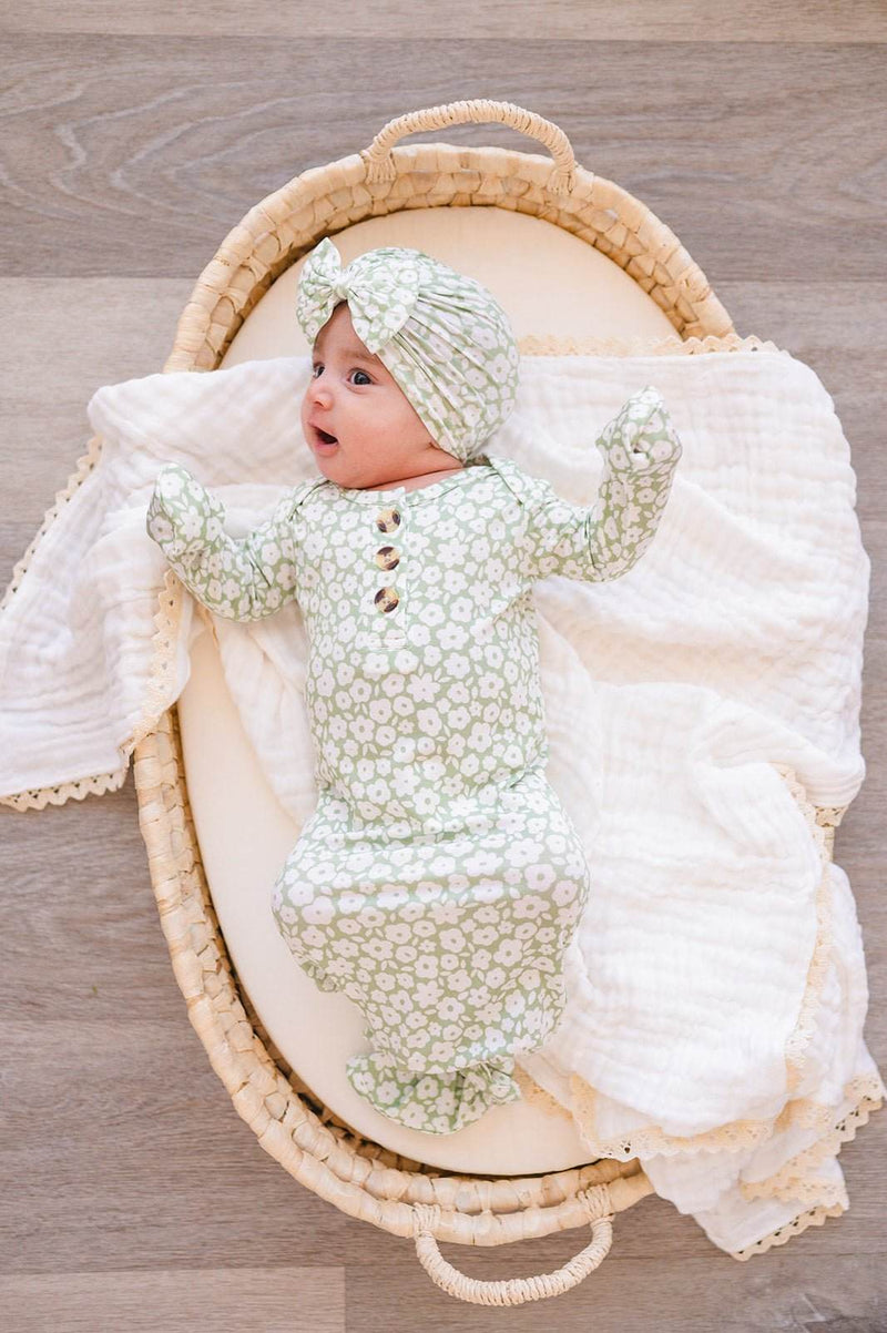 Knotted baby gown in sage ditsy floral pattern made from bamboo viscose, perfect for newborns.