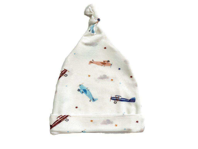 Knotted baby gown with vintage airplane pattern, bamboo material.