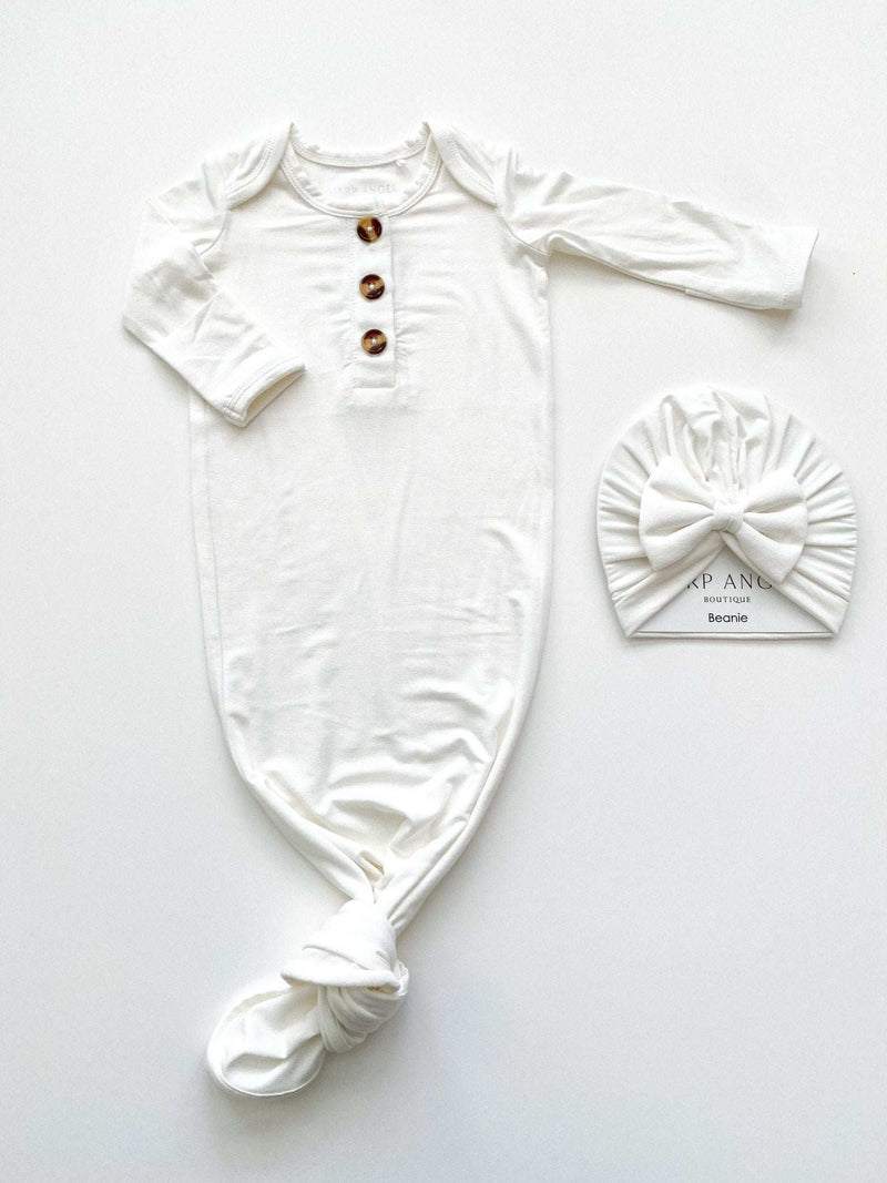 White bamboo knotted baby gown with wooden buttons and matching turban, designed for comfort and easy diaper changes.