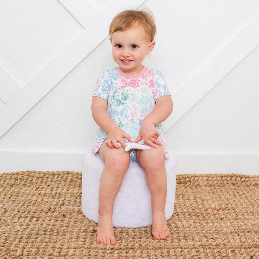 Baby bodysuit dress with koi fish print, short sleeves, and snap closure at the inseam