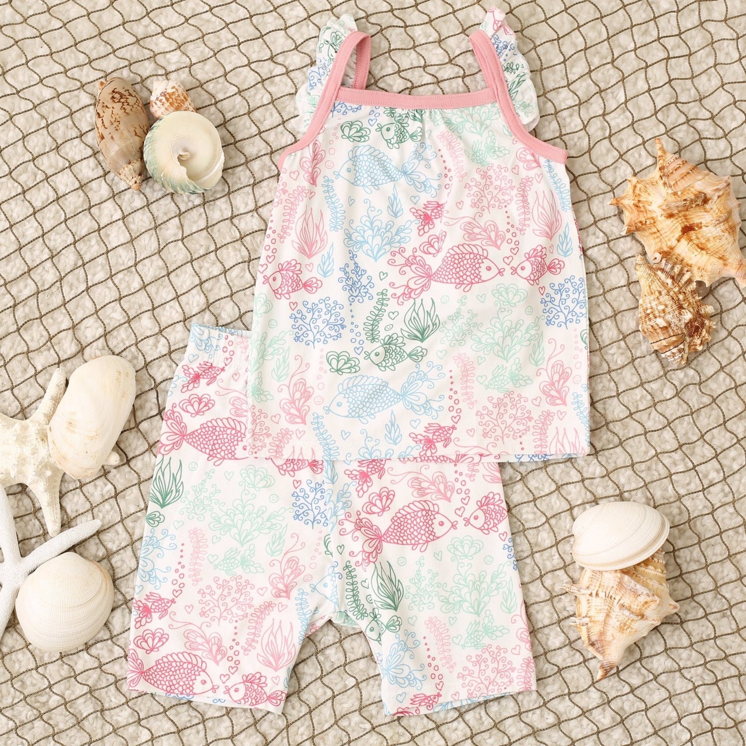Two-piece baby pajama set with flutter sleeves and shorts in a koi fish print