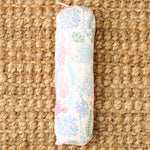 Baby swaddle blanket with a koi fish print, spread flat to show the pattern