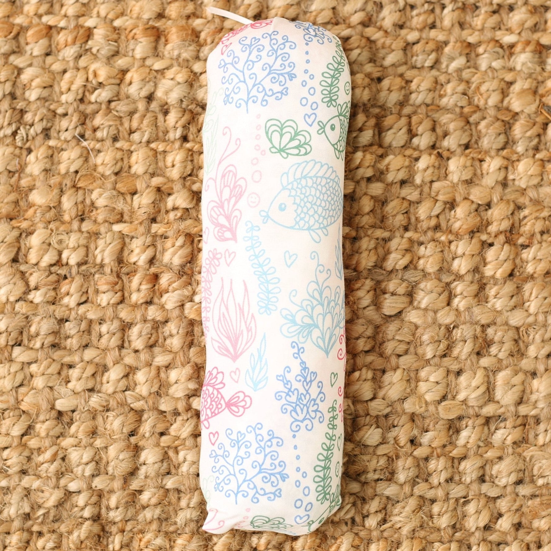 Baby swaddle blanket with a koi fish print, spread flat to show the pattern