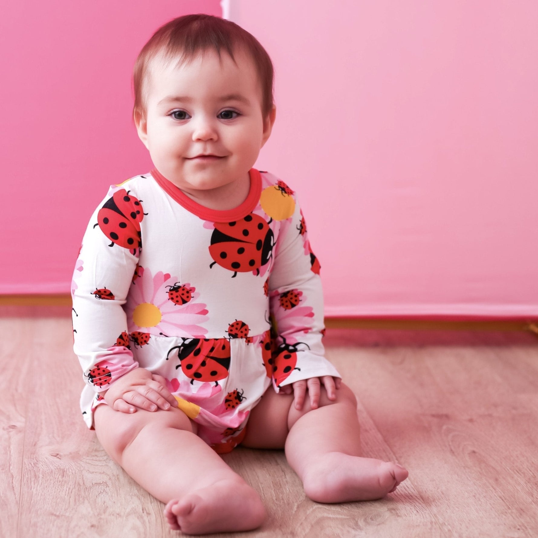 Ladybug-print long-sleeve bodysuit dress with red and pink polka dot styling