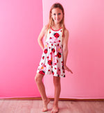 Ladybug-print long-sleeve toddler dress with a full skirt in red and pink tones