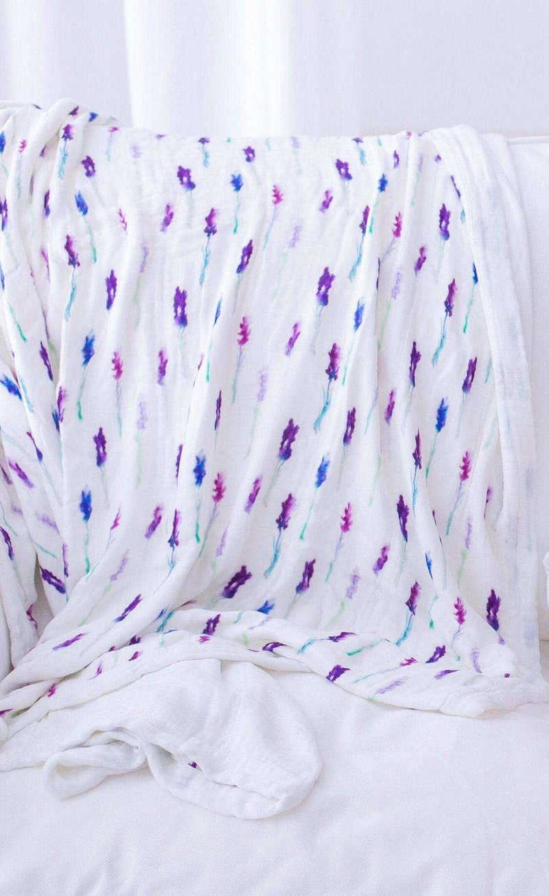 Lavender and white bamboo muslin blanket with floral pattern.