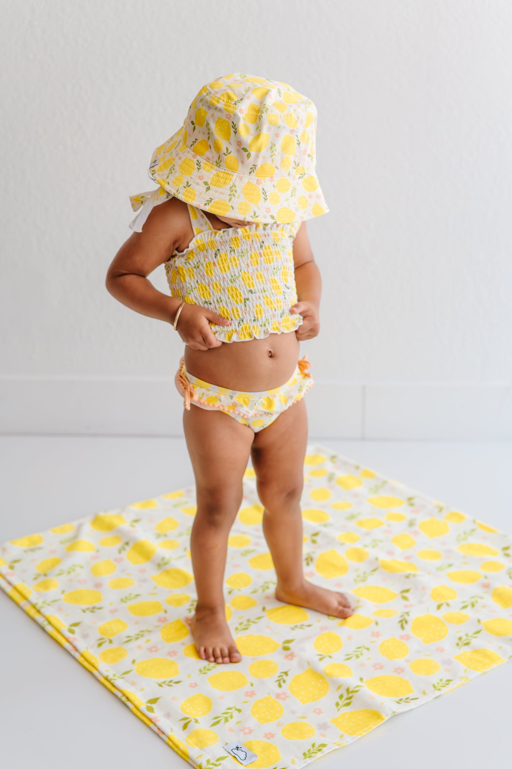 DREAM BIG LITTLE CO LEMON BLOSSOMS DREAM SMOCKED TANKINI TWO PIECE SWIM SUITEveretts Place