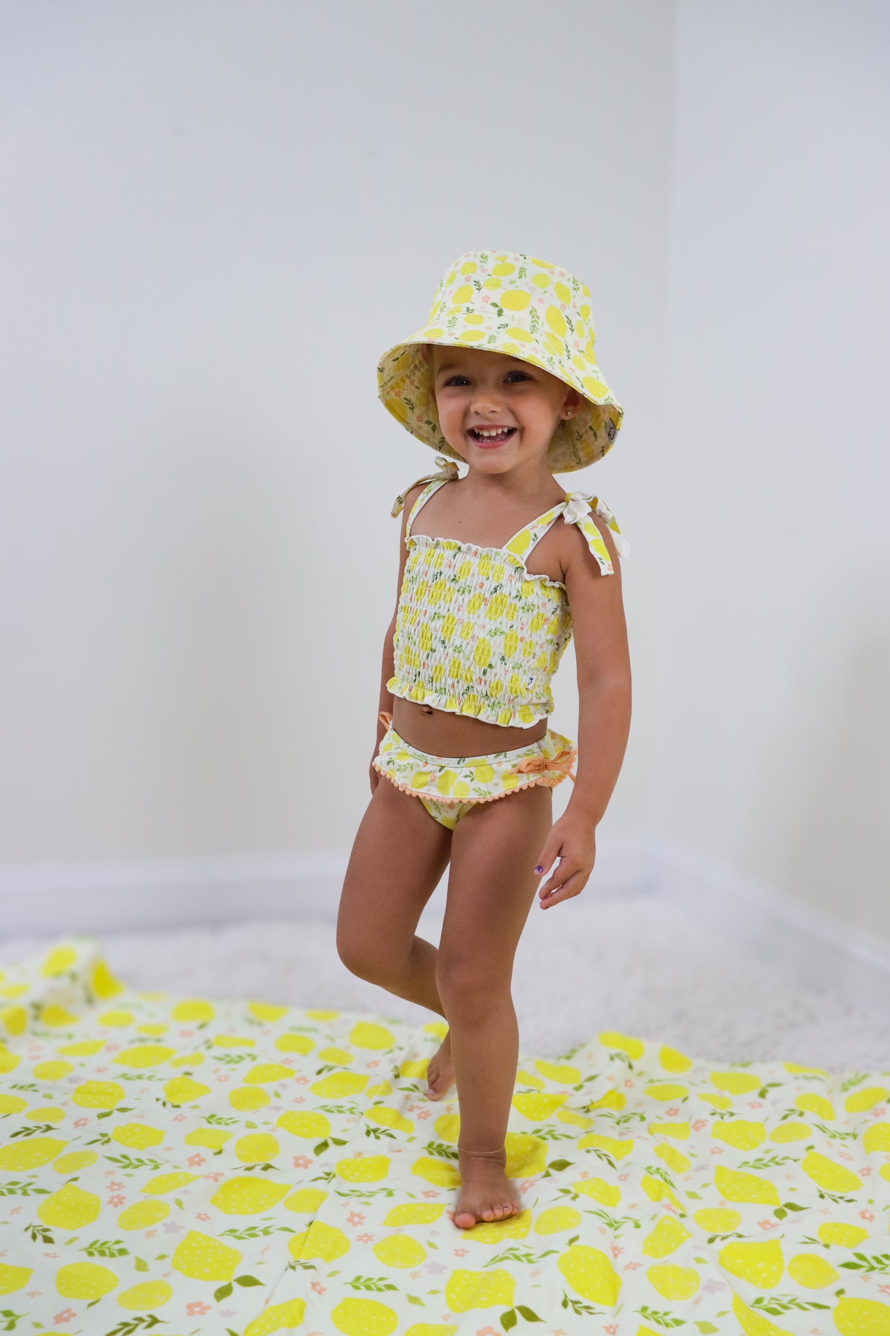 DREAM BIG LITTLE CO LEMON BLOSSOMS DREAM SMOCKED TANKINI TWO PIECE SWIM SUITEveretts Place