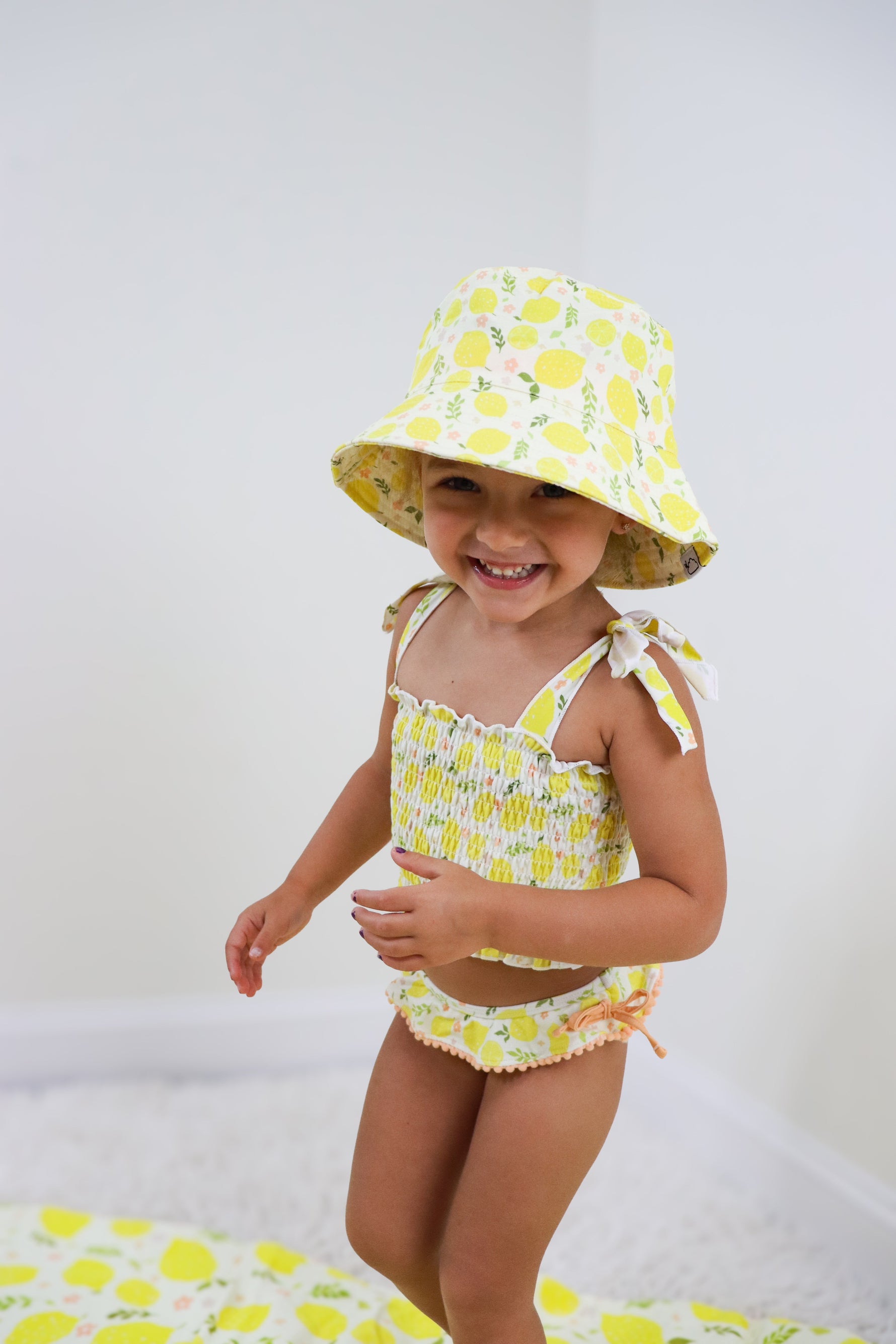 DREAM BIG LITTLE CO LEMON BLOSSOMS DREAM SMOCKED TANKINI TWO PIECE SWIM SUITEveretts Place