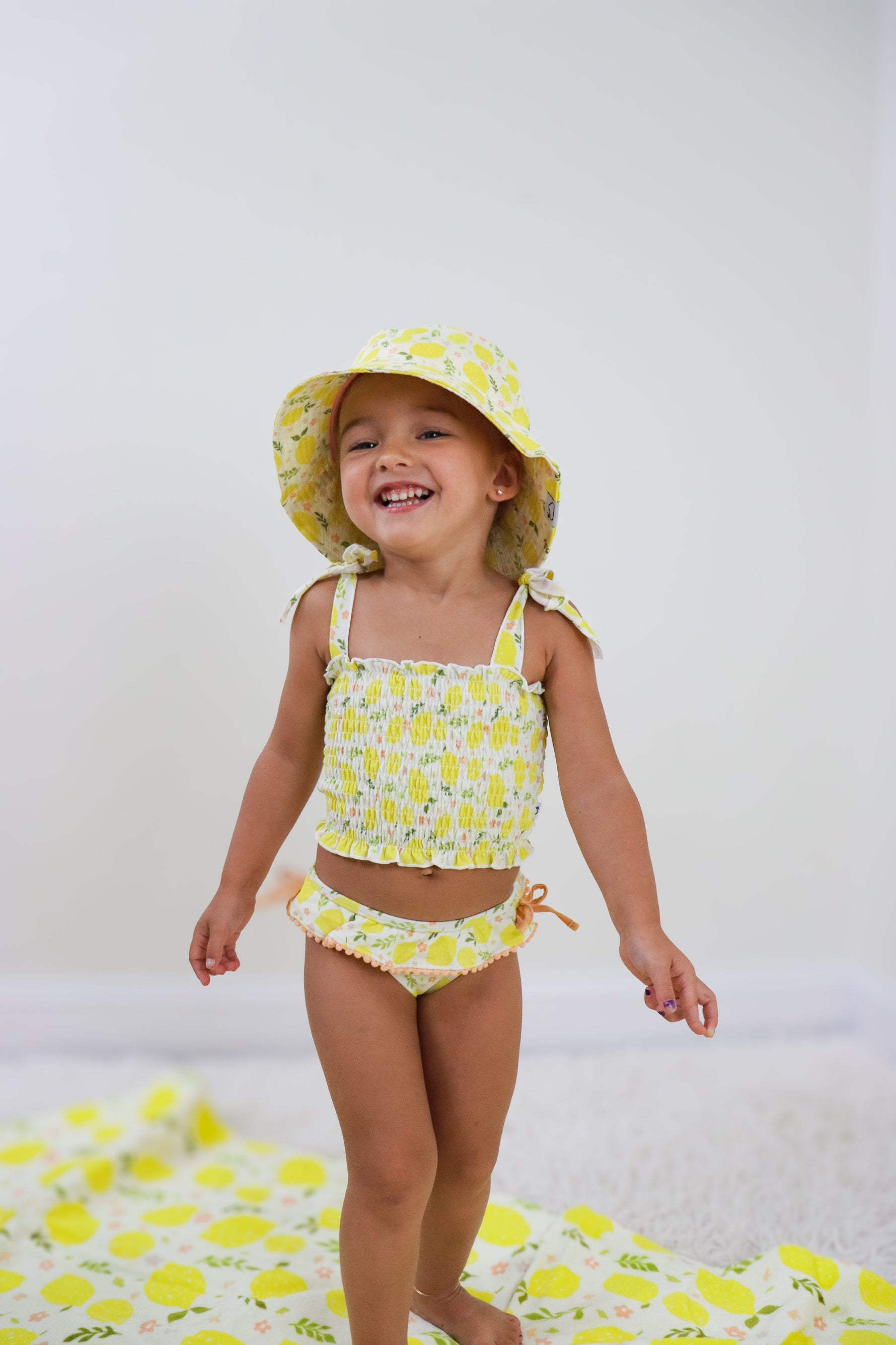 DREAM BIG LITTLE CO LEMON BLOSSOMS DREAM SMOCKED TANKINI TWO PIECE SWIM SUITEveretts Place